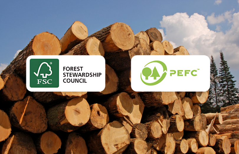 A pile of cut logs with FSC and PEFC logos